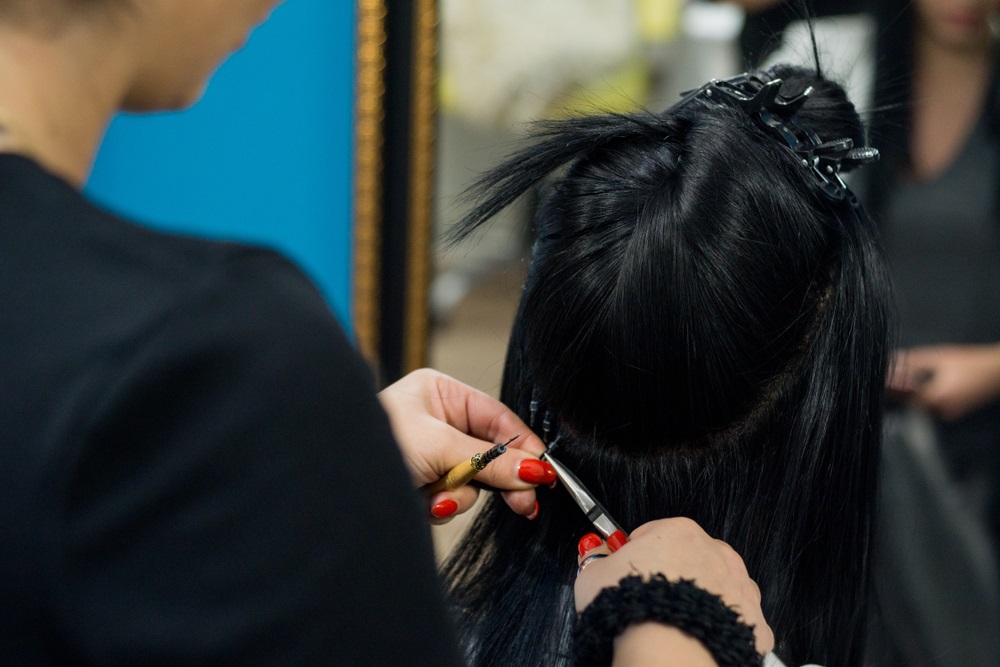 Close-up of micro ring hair extensions showing attachment points for durability.