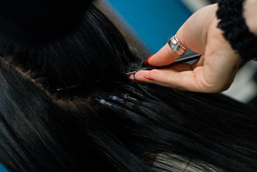 Close-up of micro ring hair extensions showing attachment points for durability.