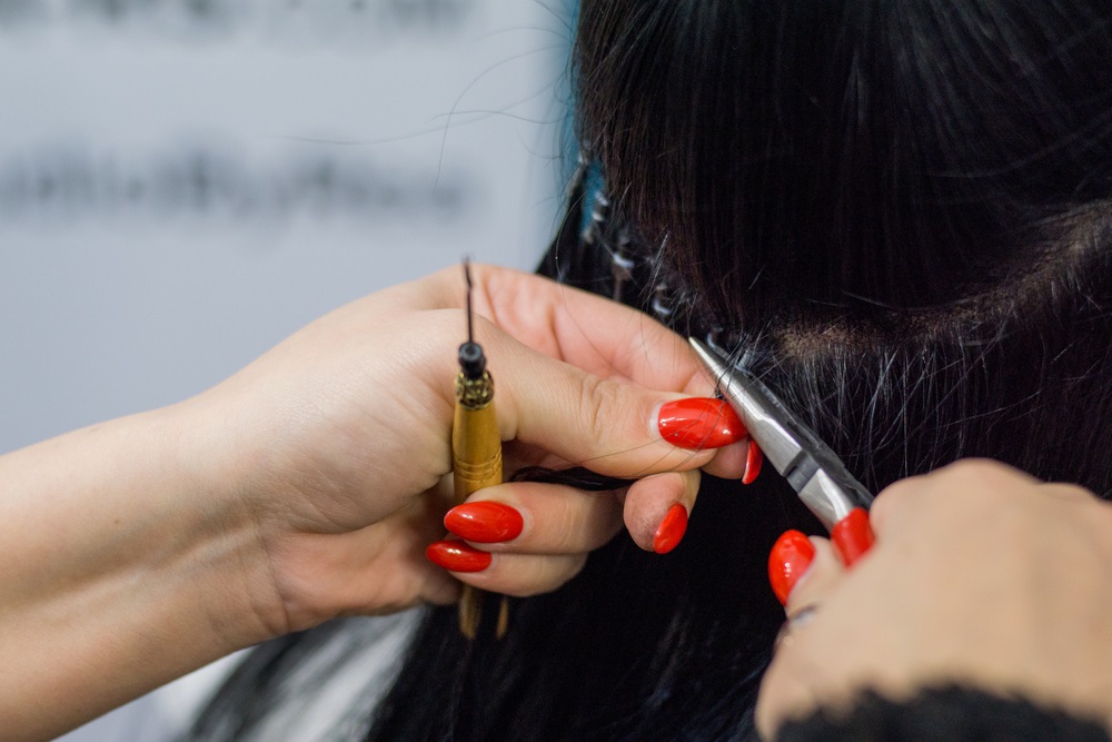 Close-up of micro ring hair extensions showing attachment points for durability.